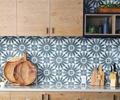 a wooden cutting board sitting on top of a counter