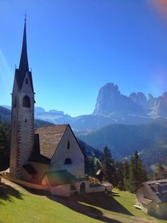 an old church in the middle of mountains