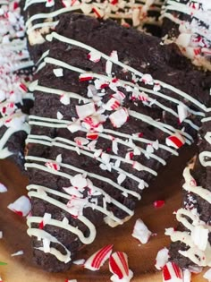 a chocolate cake with white frosting and candy canes