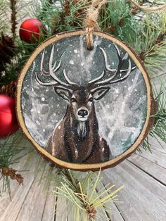 a deer ornament hanging from a christmas tree