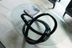 a glass table with a book on it