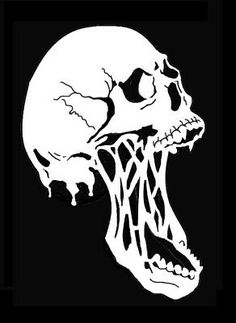 a black and white image of a skull with its mouth open