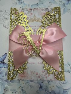 a pink and gold card with a horse on it