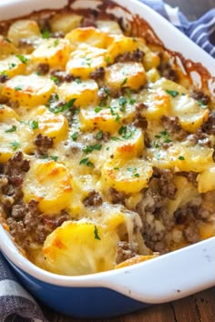 a casserole dish filled with potatoes and meat