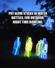 three glowing bottles sitting in the grass with text that reads put glow sticks in water bottles, for outdoor night time bowling