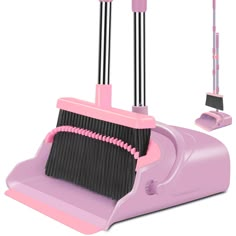 a pink and black dustpan with two brooms