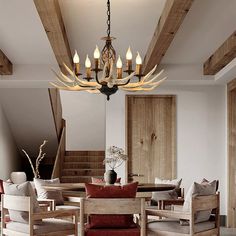 a chandelier hanging from the ceiling in a dining room