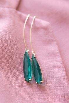 Emerald Green Pendant Earrings ⟡ all items are designed and handcrafted in our studio ⟡ Long green glass and gold teardrop earrings. Introducing our emerald pendant earrings - a stunning addition to any jewelry collection. They feature a beautiful glass stone set in a gold plated setting, creating a perfect balance of elegance and luxury. The long ear wire adds a dramatic touch to any outfit, making them perfect for both formal and casual occasions. OVERVIEW-3" in length-glass crystals-gold plat Gold Threader Earrings, Bridal Bouquet Charms, Gold Teardrop Earrings, Threader Earrings Gold, Green Pendant, Bouquet Charms, Green Pendants, Emerald Pendant, Filigree Design