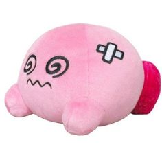 a pink stuffed animal with a cross on it's chest and eyes drawn on