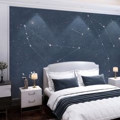 a bed room with a neatly made bed and stars on the wall