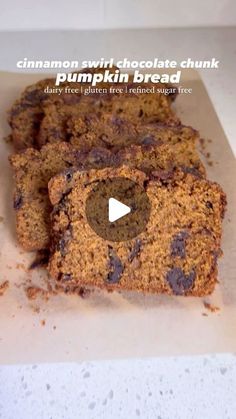 cinnamon swirl chocolate chunk pumpkin bread on a piece of parchment paper with the words, cinnamon swirl chocolate chunk pumpkin bread