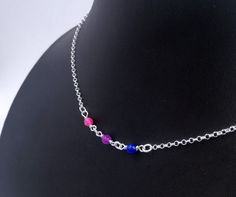 "Handmade sterling silver necklace. Different colored crystal beads making up the bisexual pride flag. Delicate silver chain. Order at least 2.5 cm (1\") longer than the intended wearers neck for a tight fit. Longer for a looser fit. Matching bracelet: https://www.etsy.com/listing/1024658633 Necklace and bracelet set (lower price): https://www.etsy.com/listing/1010685590 This is is a made to order listing and you'll get a necklace like the one in the pictures, not the exact copy in the pictures. Sterling Silver Crystal Necklace With Silver Beads For Gift, Gift Sterling Silver Crystal Necklace With Silver Beads, Gift Crystal Necklace With Beaded Chain In Sterling Silver, Sterling Silver Crystal Necklace With Beaded Chain For Gift, Gift Crystal Necklace With Beaded Sterling Silver Chain, Lesbian Beaded Necklace, Pride Beaded Necklace, Hidden Bisexual Jewelry, Bisexual Earrings