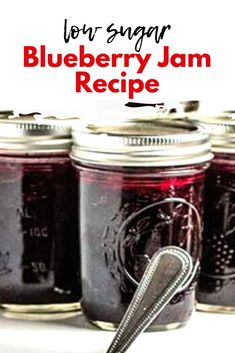 blueberry jam recipe in mason jars with a spoon on the side and text overlay that reads low sugar blueberry jam recipe