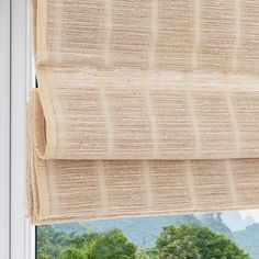 an open window with the blinds pulled back