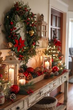 a christmas mantle with candles and wreaths on it, surrounded by other holiday decorations