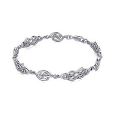 From the creative genius of Peter Stone, this Sterling Silver Celtic Knotwork Bracelet was created with passion and pride in Thailand. Showcasing the unmatched craftsmanship of Peter Stone Artisans, it is the highest quality .925 true sterling silver. Meticulously crafted with minimal impact on the environment and hand polished, it is hypoallergenic, nickel and lead free. Each piece of Jewelry is a work of art with exceptional detail from the Heart. Adorn your wrist with Celtic charm with the Celtic Knotwork Silver Bracelet featuring an intricate knotwork design. Peter Stone the world's leading manufacturer of fine sterling silver jewelry has created the Celtic Knotwork Collection to celebrate Celtic Heritage and capture the intricate knotwork designs that have inspired mankind for ages. M Peter Stone, Celtic Heritage, Silver Gold Jewelry, Celtic Knotwork, Gold Jewelry Stores, Yoga Jewelry, Gold Jewelry Indian, Fine Jewelry Bracelets, Emerald Jewelry