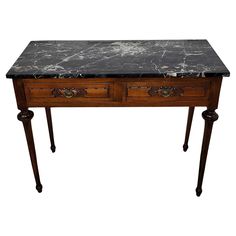 a marble top desk with two drawers