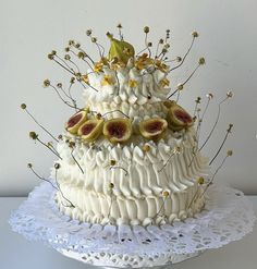 a white cake decorated with figurines and flowers