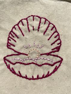 a close up of a piece of cloth with embroidery on it