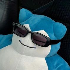 a blue and white stuffed animal wearing sunglasses