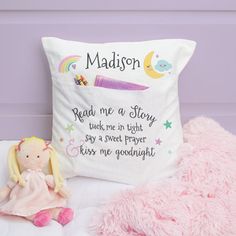 a stuffed doll next to a pillow with the words madison on it and a pink teddy bear