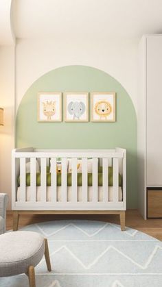 a baby's room with a white crib and green walls