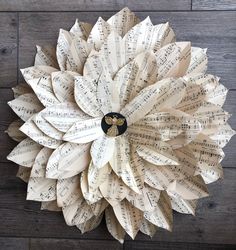 a paper flower made out of sheet music