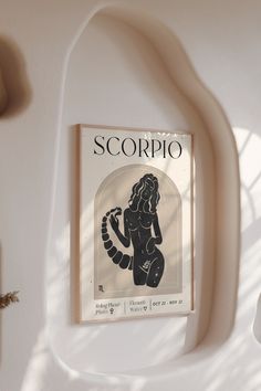 an advertisement for scorpio hangs on the wall