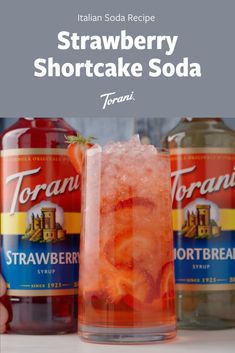 strawberry shortcake soda with ice and strawberries in it