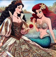 two women dressed as mermaids sitting next to each other