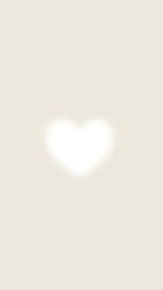 the shadow of a heart is shown on a beige background in this image, it appears to be from above