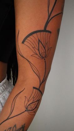 a woman with a tattoo on her arm