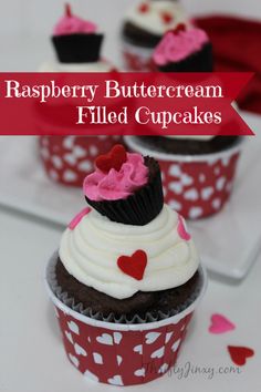 raspberry buttercream filled cupcakes on a plate