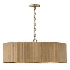 a light fixture with a beige shade hanging from the ceiling