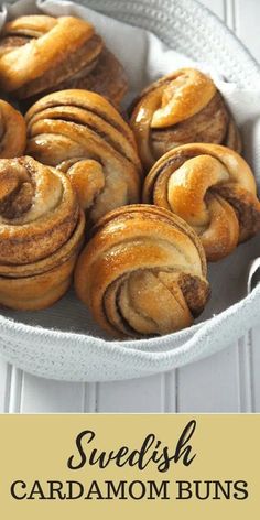 some cinnamon buns in a pan on a white table with the words swedish cardamom buns