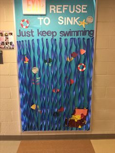 a bulletin board that says refuse to sink, just keep swimming and life savers