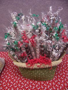 a basket filled with lots of different types of toothbrushes on top of a table