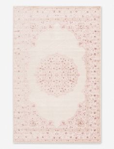 a pink rug with an intricate design on it