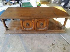 an old wooden table with two drawers