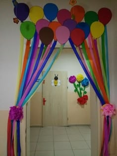 a hallway decorated with balloons and streamers