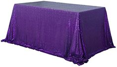 a purple table cloth with silver sequins on it