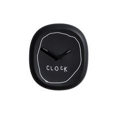 a black clock with the word clock written on it's face and hands in white lettering