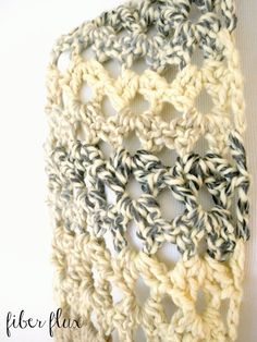 a crocheted scarf hanging on the wall with text overlay that reads, free crochet pattern