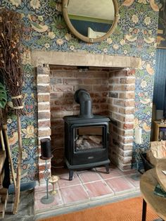 a fireplace with a mirror above it in a living room