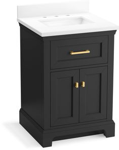 a white sink sitting next to a black cabinet