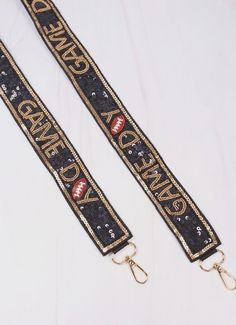 This stunning purse strap is covered in sequins with a beaded trim accent. "GAME DAY" is repeated on the strap with beaded footballs making it sure to be a statement at the tailgate! This strap easily clips onto any purse or clear bag that has removable strap compatibility. Dimensions: 47.5" including clips Game Day Bag Straps, Game Day Bag, Gameday Dress, Clear Bag, Rose Jewelry, Bag Icon, Purse Strap, Clear Bags, Beaded Trim