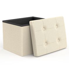 an upholstered storage box is shown with the lid open and it's bottom closed