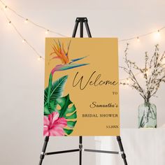 an easel with a welcome sign on it