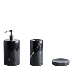 black marble bathroom accessories set with soap dispenser and toothbrush holder on white background