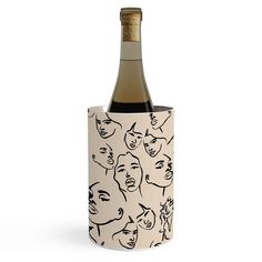 a bottle of wine in a cup with faces on it